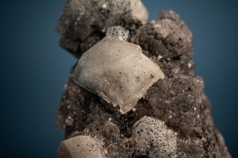 PHENAKITE with HEMATITE on QUARTZ