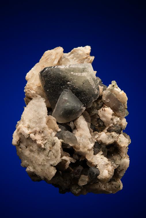 PHENAKITE on QUARTZ var. Smoky and CALCITE