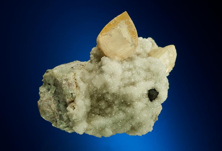CALCITE with COPPER on ANALCIME