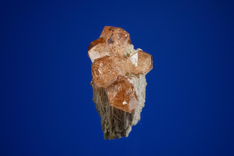 GROSSULAR var. Hessonite on DIOPSIDE