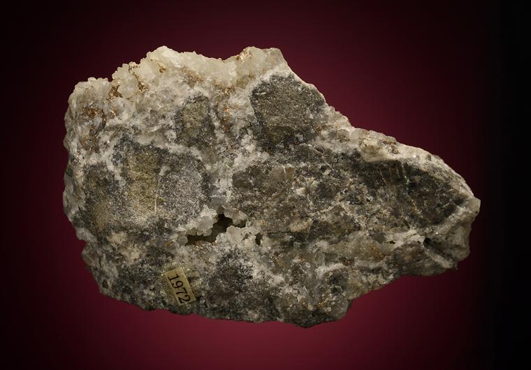 MELONITE after CALAVERITE on QUARTZ