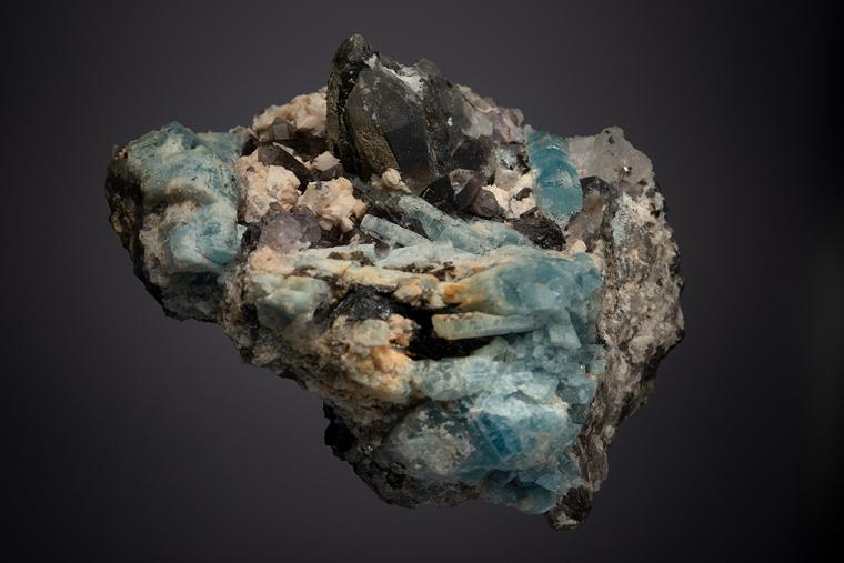 BERYL var. Aquamarine WITH QUARTZ var. Smoky, Adularia, FLUORITE and HEMATITE