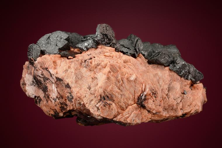 HEMATITE on MICROCLINE