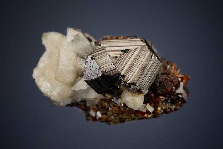 SPHALERITE with QUARTZ and CALCITE on ANDRADITE