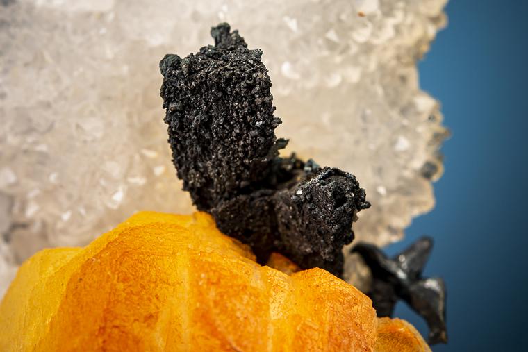 ACANTHITE after PYRARGYRITE(?) with CALCITE on QUARTZ