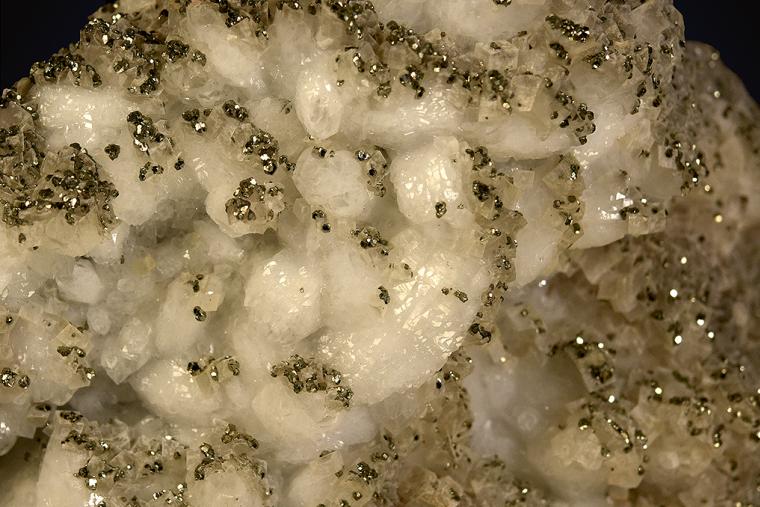 PYRITE with DOLOMITE on QUARTZ
