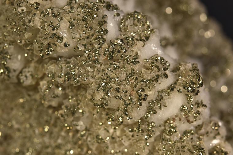 PYRITE with DOLOMITE on QUARTZ