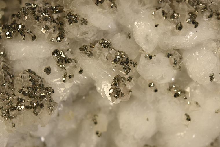 PYRITE with DOLOMITE on QUARTZ
