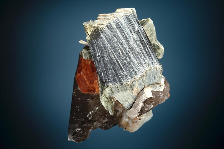 SPESSARTINE with MUSCOVITE and QUARTZ var. Smoky on ALBITE var. Cleavelandite