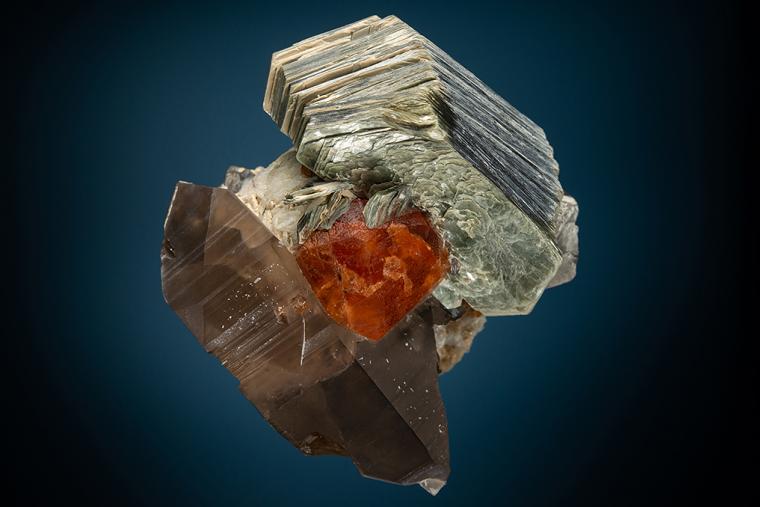 SPESSARTINE with MUSCOVITE and QUARTZ var. Smoky on ALBITE var. Cleavelandite