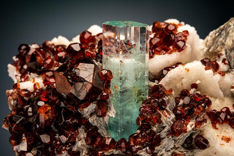 BERYL var. Aquamarine with SPESSARTINE on MICROCLINE and MUSCOVITE