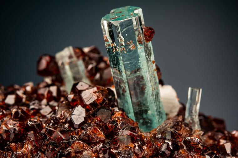 BERYL var. Aquamarine with SPESSARTINE on MICROCLINE and MUSCOVITE