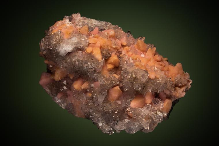 RHODOCHROSITE after CALCITE on QUARTZ var. Amethyst