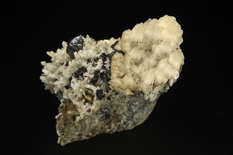 CALCITE with PYRRHOTITE and SPHALERITE on QUARTZ