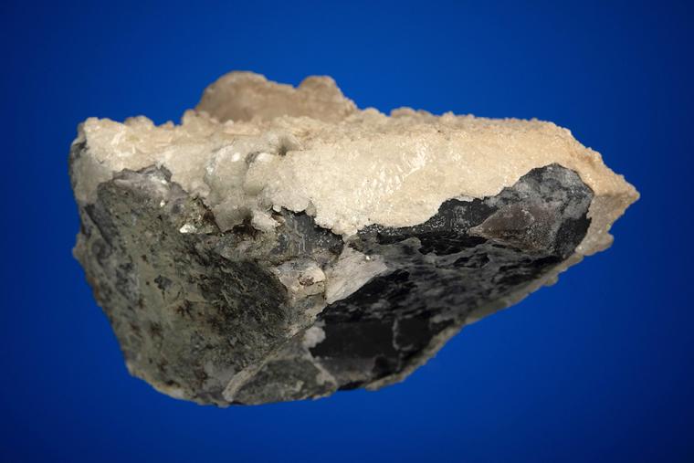 CALCITE on QUARTZ var. Smoky