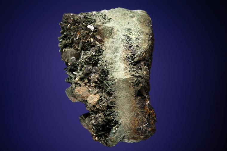 PYRITE with MAGNETITE on ACTINOLITE after DIOPSIDE 