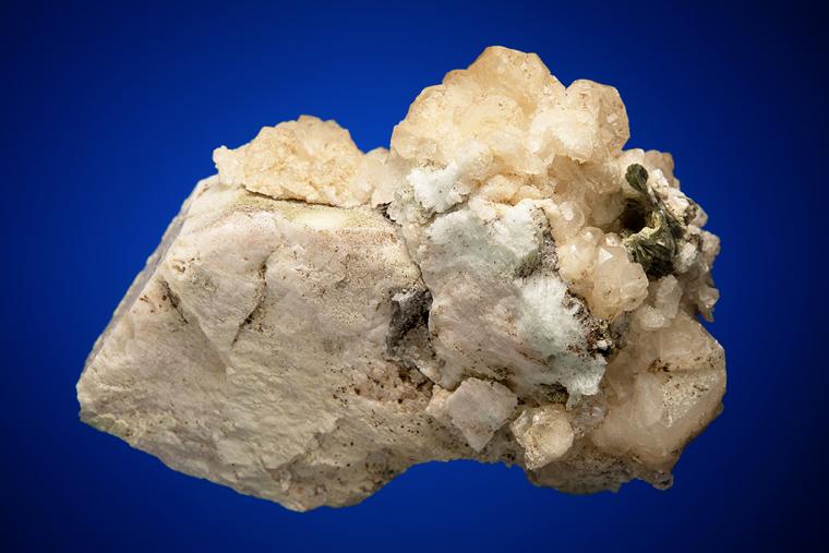 CALCITE with MUSCOVITE on ALBITE and MICROCLINE