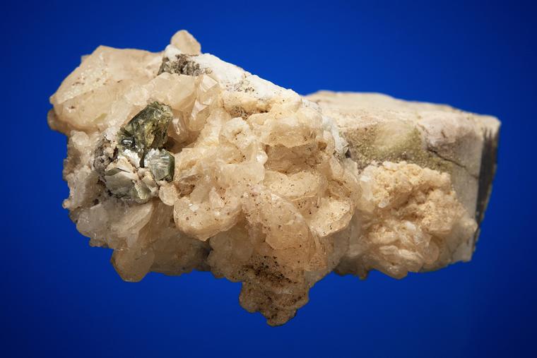CALCITE with MUSCOVITE on ALBITE and MICROCLINE