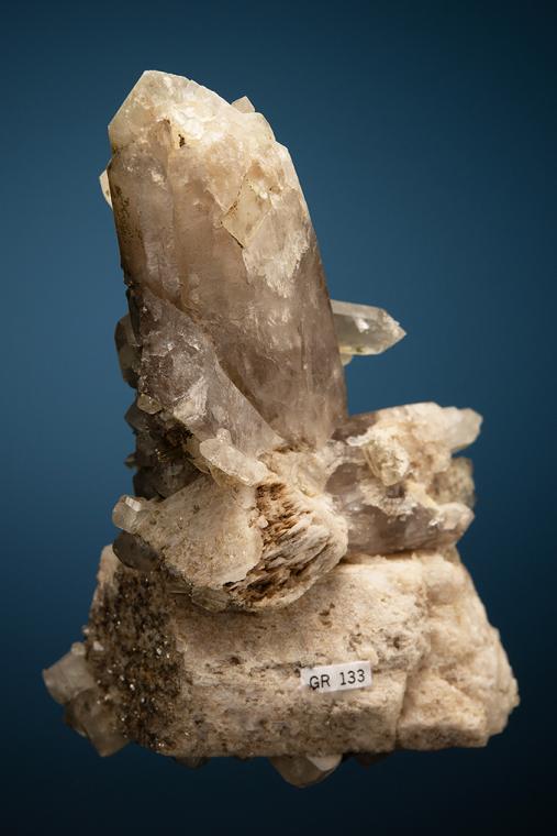 PHENAKITE on QUARTZ var. Smoky and MICROCLINE