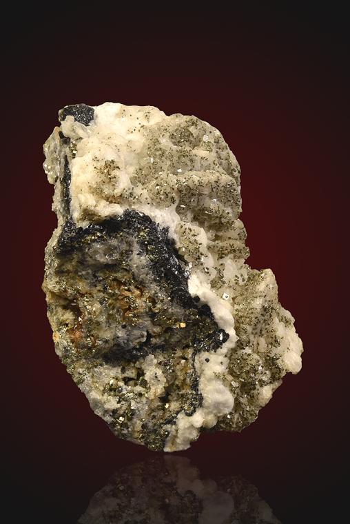 DOLOMITE after SIDERITE(?) with PYRITE on QUARTZ
