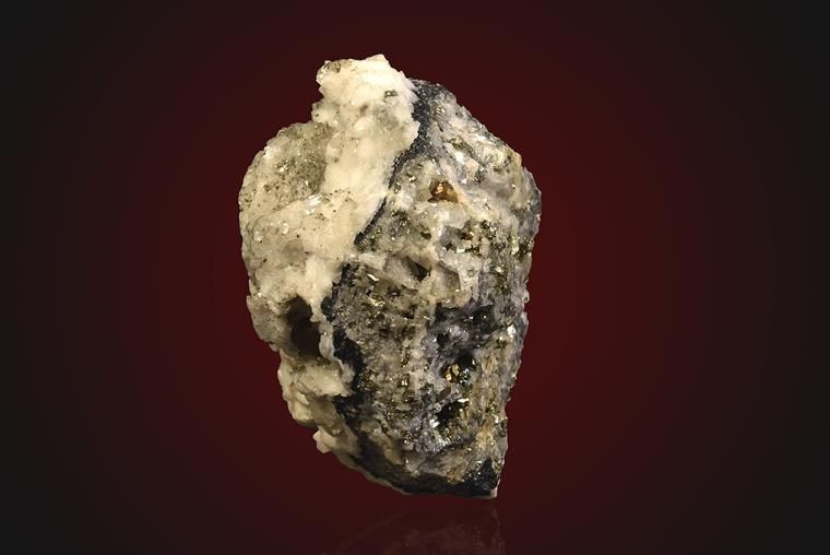 DOLOMITE after SIDERITE(?) with PYRITE on QUARTZ
