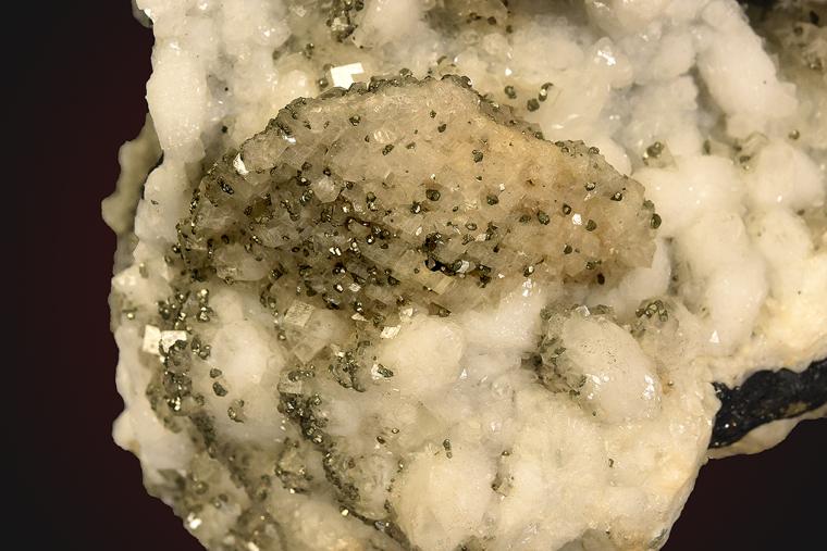 DOLOMITE after SIDERITE(?) with PYRITE on QUARTZ